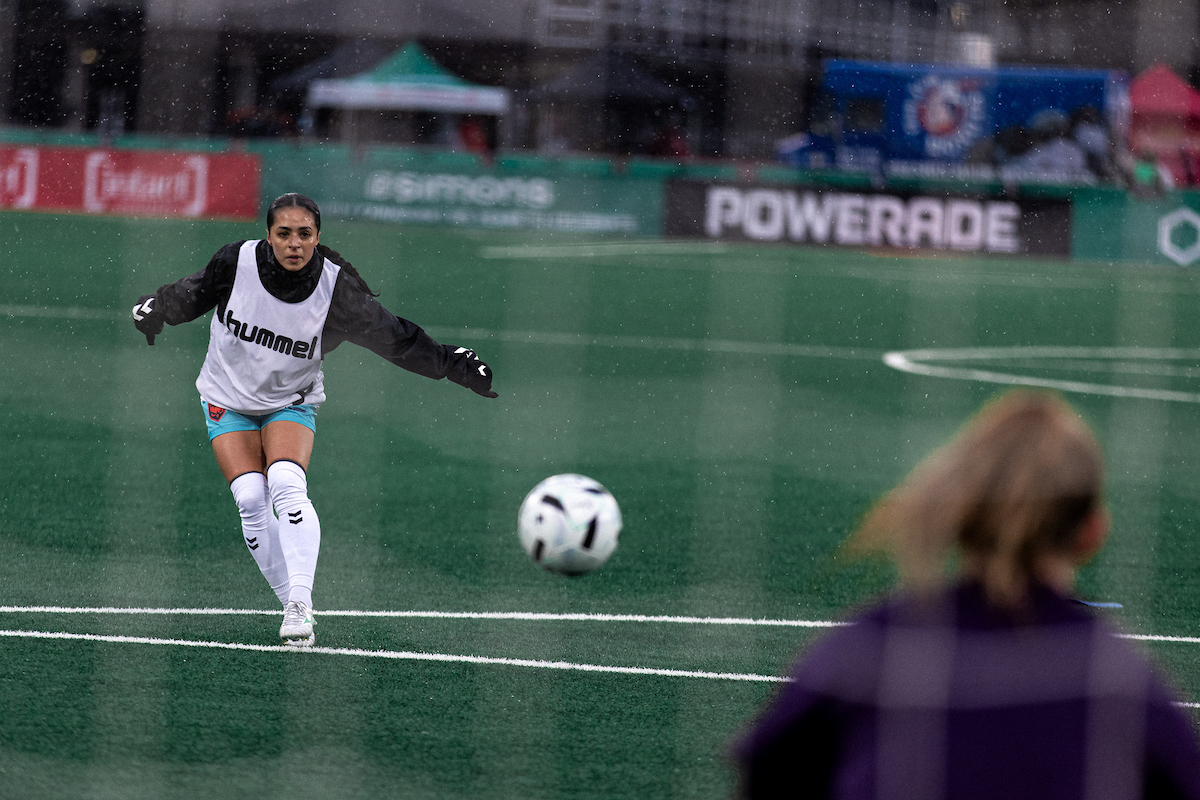 Jaclyn Sawicki kicks a ball during practice
